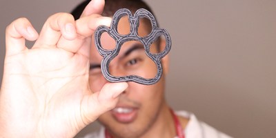 Arnel Ordonio looking through a 3d printed paw