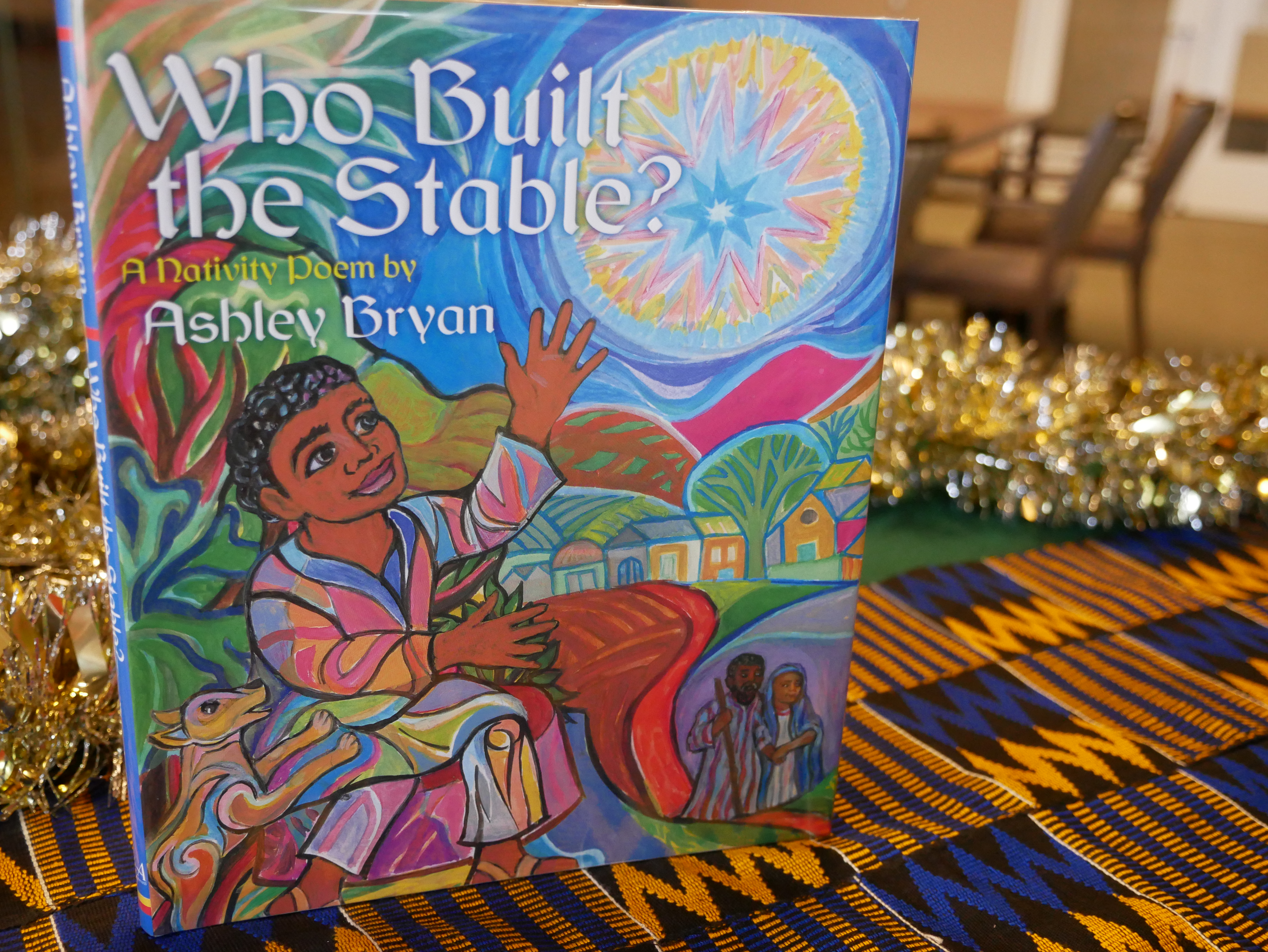 Who Built the Stable? A Nativity Poem by Ashley Bryan (Atheneum Books, 2012) PZ 8.3 .B8286 Wh 2012 Retelling of Nativity story with African characters, vibrantly illustrated
