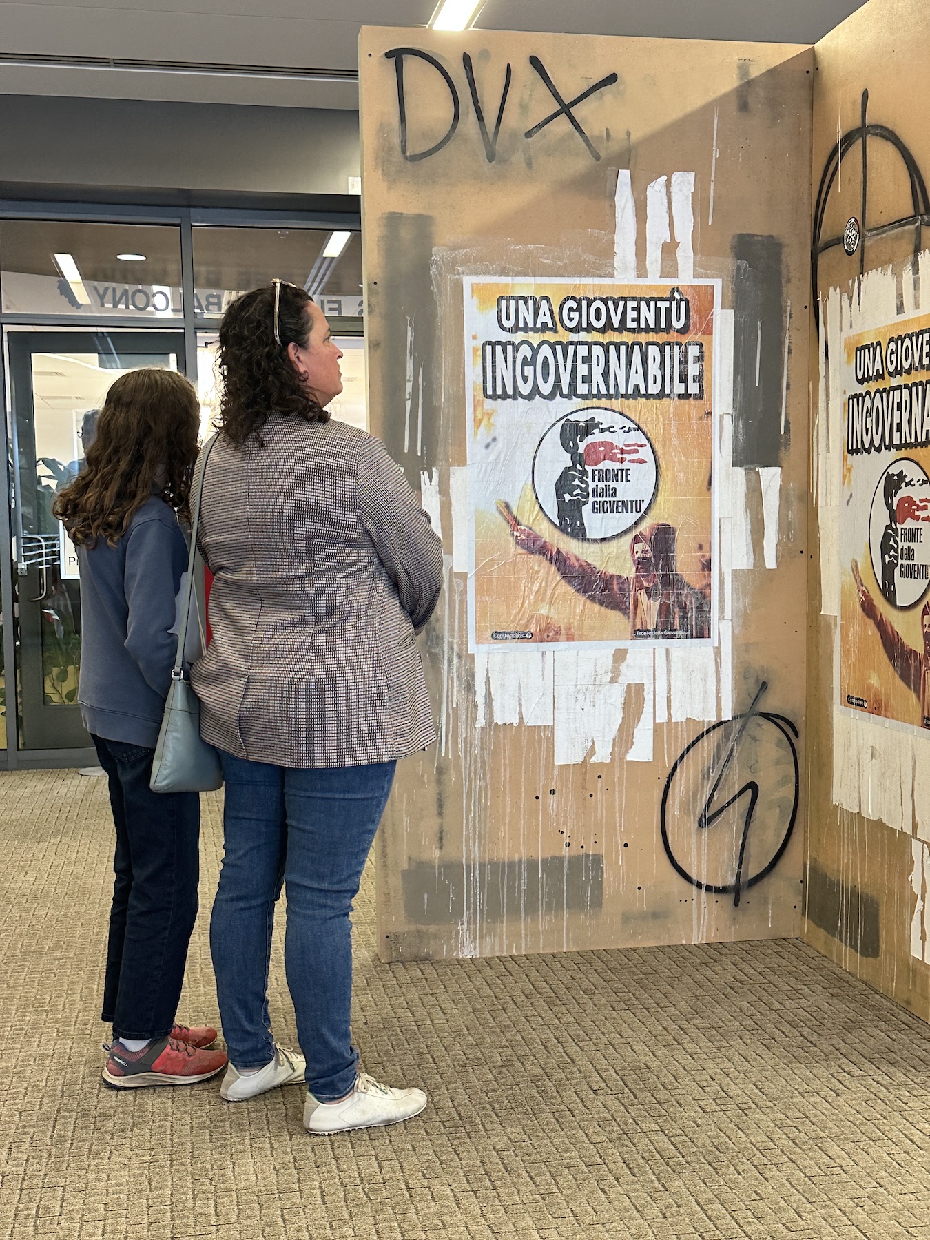 two attendees view the centerpiece of the exhibition